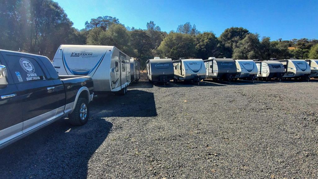 A line of RV campers ready for transport.